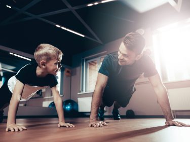 Father and son doing push ups in a Lewes gym - Olde Town